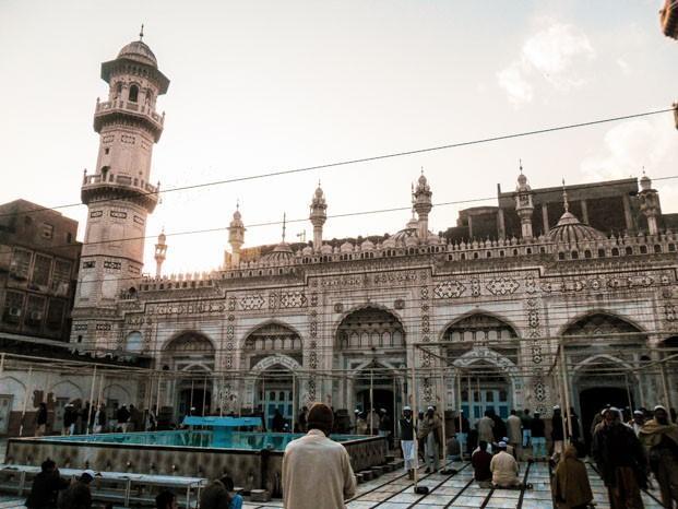 Prayer courtyard with a blue-tiled ablution pond